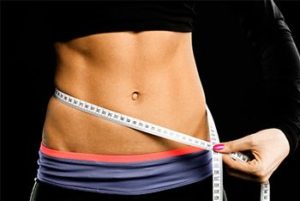 What surgical options are available to achieve a flatter stomach?